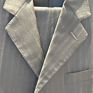 Grey high quality suit.  Pattern is shadow on shadow being very subtle.